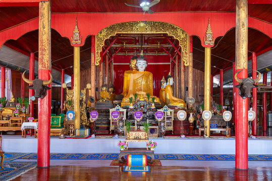 Buddhas in the sermon hall of Wat Hua Wiang in the town of Mae Hong Son in Northern Thailand. The temple, built in 1890, has Shan architectural features