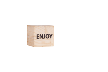 wooden cubes with the inscription Enjoy on a white isolated background close-up