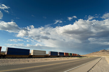 Endless Journey: 4K Ultra HD Image of Transcontinental Railroad Crossing Desert Landscape