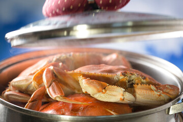 Culinary Delight: 4K Ultra HD Image of Cooking Dungeness Crab in Cast Iron Pot