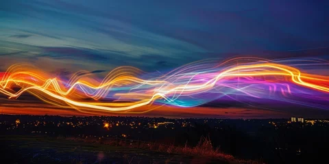 Cercles muraux Autoroute dans la nuit A colorful, long, and wavy line of lights in the sky