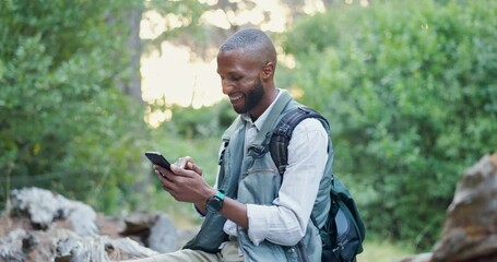Cellphone, nature and man hiking in forest networking on social media, mobile app or internet. Smile, technology and male person typing on a phone trekking in outdoor woods for exploring or adventure - Powered by Adobe