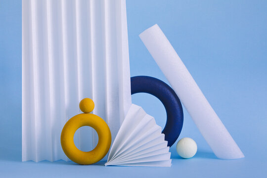 Two colored objects together on paper background