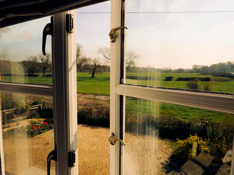 Fototapeta The view of a farm from the house window