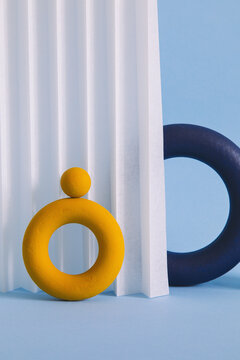 Two colored objects together on paper background