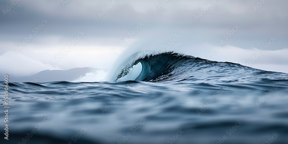 Poster a wave is crashing into the ocean, creating a beautiful and powerful scene