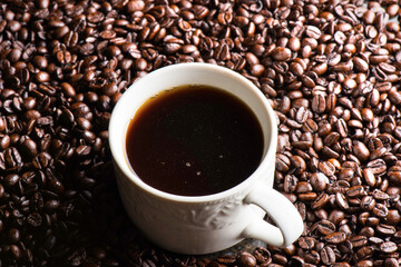 Coffee Bliss: 4K Ultra HD Image of Close-Up of Coffee Cup on Coffee Beans