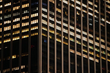 Facade of building with glass windows at night