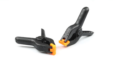 black plastic spring clamp isolated over white background