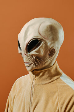 portrait of an alien on a brown background
