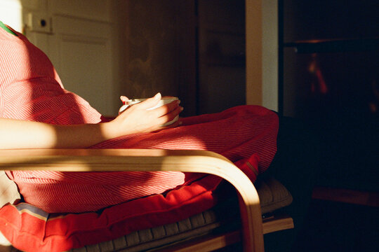 A woman with a cup of tea
