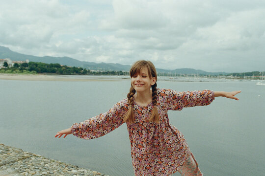 A smiling girl by the seaside