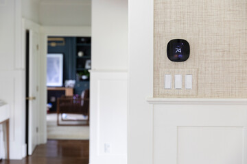 Wall Temperature digital Thermostat in Contemporary Home light switch