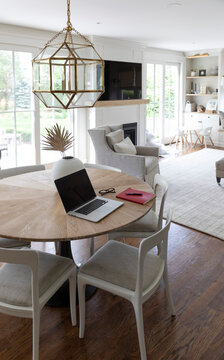 Contemporary House Book shelf cabinetry and Laptop computer on table