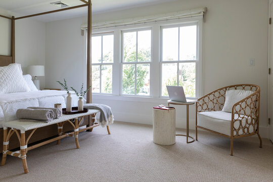 Wide angle Home bedroom with modern design chair and laptop computer 
