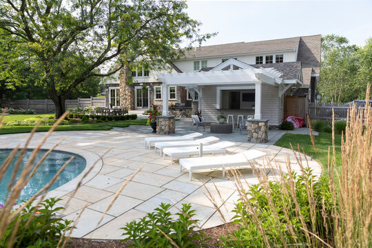 Residential luxury Home outdoor terrace garden grass swimming pool 