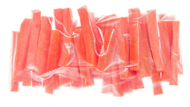 Packaging and Freezing Carrots. Carrot sticks are vacuum packed and quickly cooled with an ice jet, creating the effect of white steam on a white background