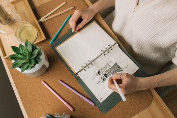 Woman creating a fashion sketch