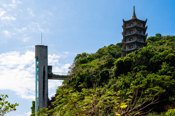 Passenger elevator lift top Marble Mountains and Pagoda in Da Nang, Vietnam