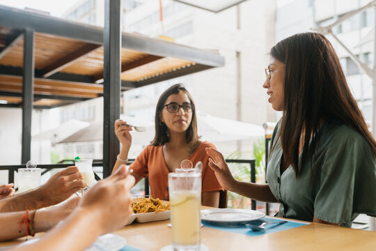 Friends enjoying lunch in a terrace