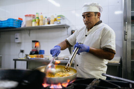 Chef Cooking Rice with Seafood