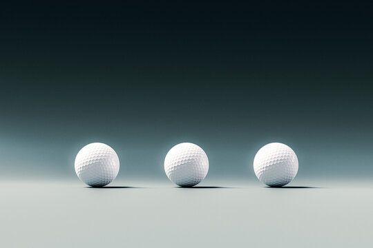 Three White Golf Balls