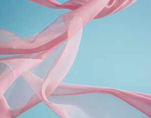 Flying pink fabric wave on blue background, flowing waving silk fluttering cloth