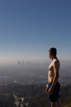 Young guy on top of the mountain