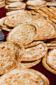 Fresh naan bread under sunlight.