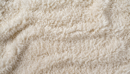 Fototapeta na wymiar Background picture of a soft fur white carpet. wool sheep fleece closeup texture background. Fake color beige fur fabric. top view.