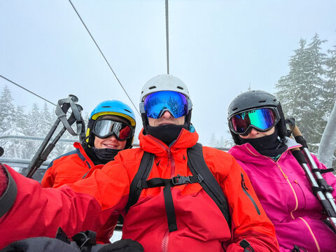 happy family in ski lift