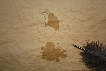 map of antigua and barbuda on a old paper background with old pen