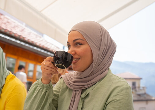 Muslim Woman Drinking Coffee