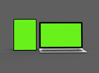 3d render of laptop and tablet with green screen on a dark background