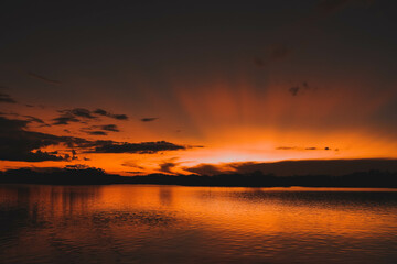 Magic orange sunset view.
A sunset is a natural phenomenon that occurs daily as the sun dips below the horizon, marking the end of daylight hours. It is a breathtaking and often picturesque event 
