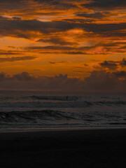 Fototapeta premium Magic orange sunset view. A sunset is a natural phenomenon that occurs daily as the sun dips below the horizon, marking the end of daylight hours. It is a breathtaking and often picturesque event 