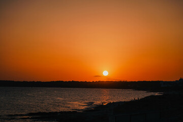Magic orange sunset view.
A sunset is a natural phenomenon that occurs daily as the sun dips below the horizon, marking the end of daylight hours. It is a breathtaking and often picturesque event 