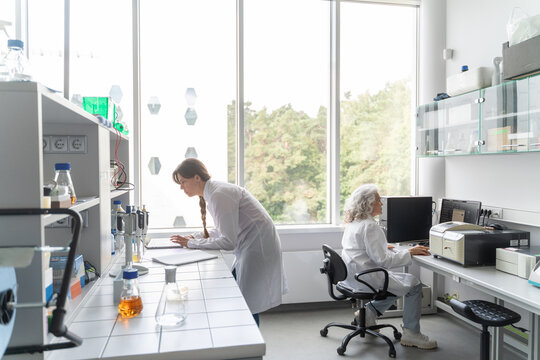 People Working In Modern Bright Laboratory