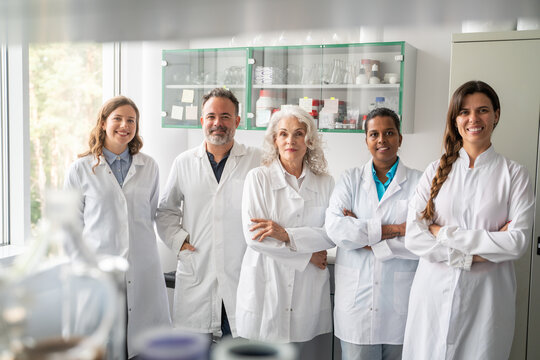Diverse Group Of Scientists In Modern Laboratory