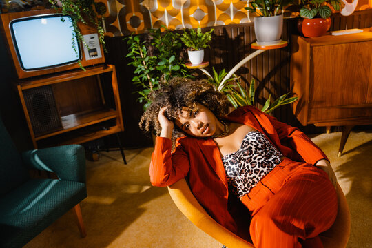 Portrait of a smiling woman in a retro interior