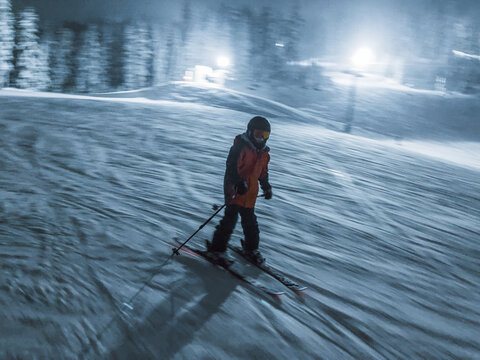 boy skiing at night