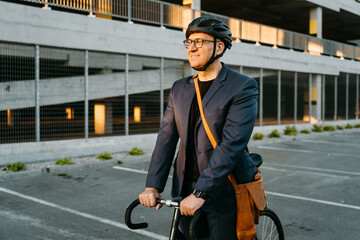 A man with a bicycle on a city street