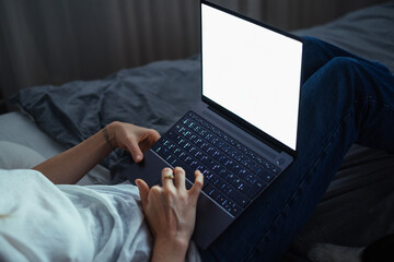 Cropped Image of Woman Typing on Laptop at Night