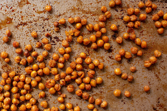 Close-up of roasted chickpeas on a sheet pan
