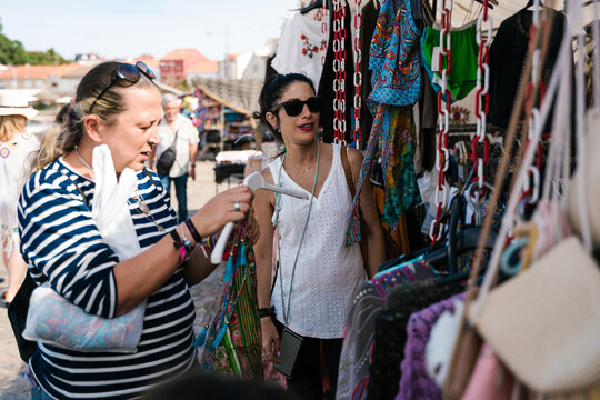 Women buying clothes on local store