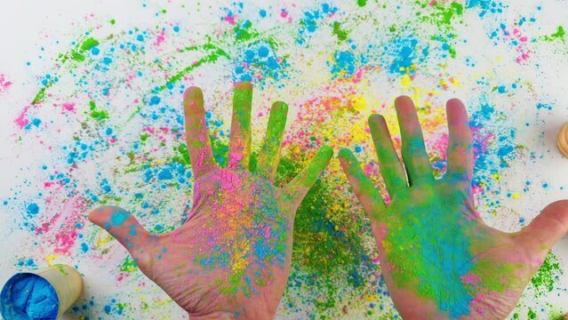 Hands Touching Holi Colored Powder On White