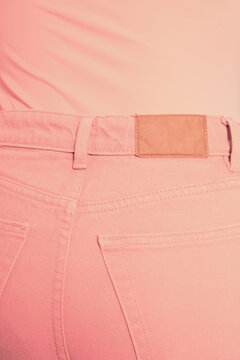 Close-up of person wearing pink jeans and pink top