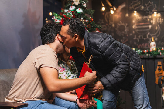 Father giving a gift to his son.