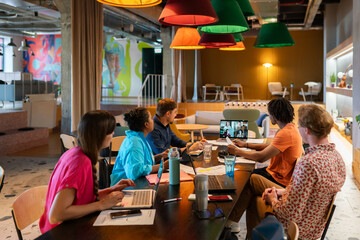 People Attending Hybrid Business Meeting At Office