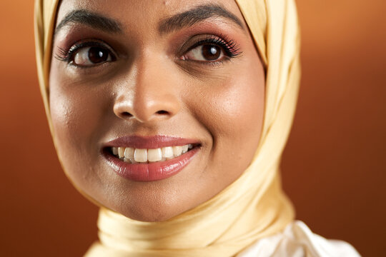 Muslim woman photographed against a seamless backdrop